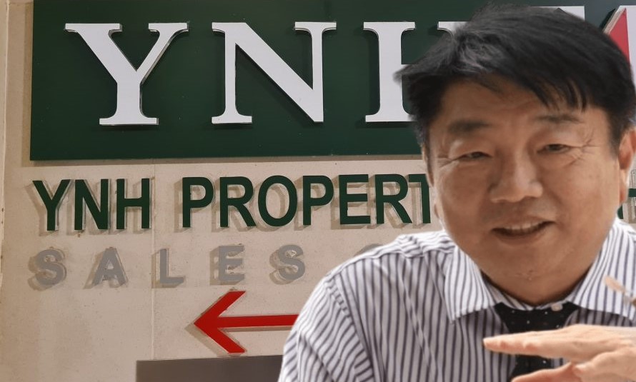 Yu Kuan Huat and Yu Kuan Chon at a YNH Property Bhd board meeting discussing joint venture agreements.