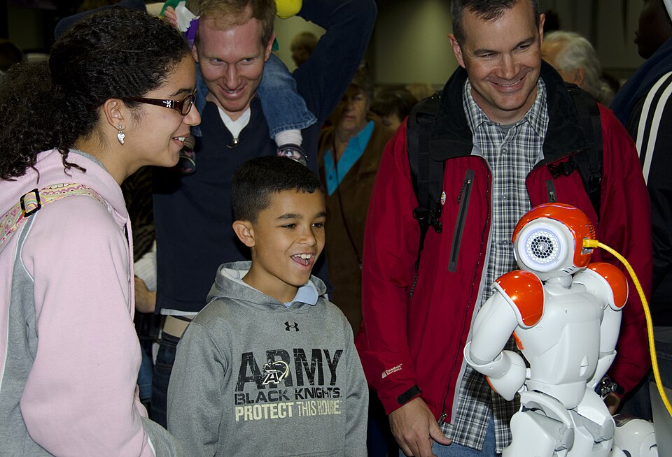 Humanoid Robot Interacting With A Person